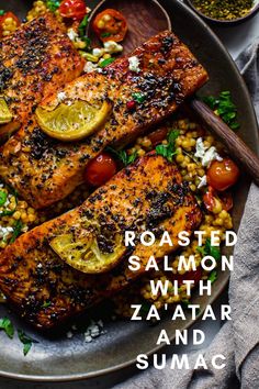 roasted salmon with zaatar and sumac on a plate next to other food