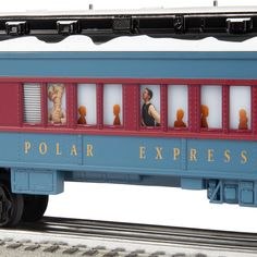 a blue and red train car with people on it