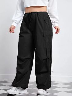 Our Flap Pocket Side Drawstring Waist Pants, you get the perfect fusion of style and comfort. Featuring flap pockets on the sides and a drawstring waist, these pants offer practicality and a modern design. The drawstring waist ensures a customized fit, while the high-quality materials provide durability and a soft feel. Whether lounging at home or going for a casual outing, these pants are a stylish choice. Details: Type: Cargo Pants Closure Type: Drawstring Waist Details: Drawstring, Pocket Wai Utility Pants With Drawstring For Fall, Fall Utility Pants With Drawstring, Solid Pants With Drawstring For Streetwear, Functional Drawstring Pants For Streetwear, Fall Drawstring Trousers, Baggy Drawstring Pants For Fall, Baggy Drawstring Parachute Pants For Fall, Baggy Parachute Pants With Drawstring For Fall, Utility Style Parachute Pants With Drawstring For Fall