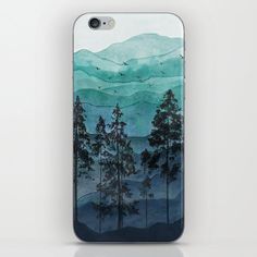 an iphone case with trees and mountains in the background