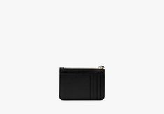 a black card case on a white background with an empty wallet in the foreground