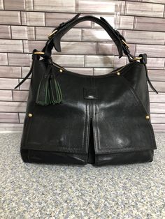 Rare Dooney & Bourke  Florentine  Kingston black leather hobo Shoulder bag. pre- owned  gently used Excellent Condition   Measures approximately 16" x 10.5" x 6" .  shoulder  strap drop 9"  .  2 tall  front zip pocket   .and top zip closure.   4 bottom  brass  feet . Lined interior . with 2 slip pocket  and  one zip pocket . Dooney Bourke Handbags Hobo Shoulder Bags, Hobo Purses Dooney & Bourke, Hobo Shoulder Bag, Dooney And Bourke, Every Thing, Dooney & Bourke, Holiday Deals, Leather Hobo, Kingston