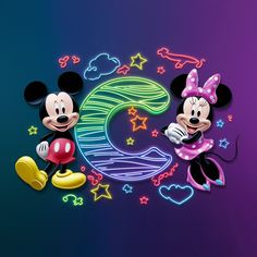 two mickey and minnie mouses are standing next to each other in front of the numbers