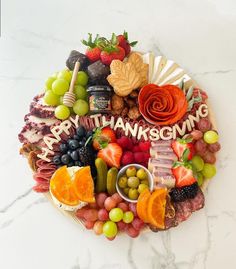 a platter filled with lots of different types of fruits and veggies on it