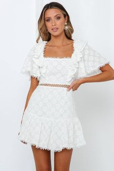 Length from shoulder to hem of size S: 83cm. White dress. Lined. Cold hand wash only. Model is a standard XS and is wearing XS. True to size. Broderie Anglaise cotton fabric; non-stretchy. Adjustable lace-up back. Invisible back zipper. Embroidered floral motifs may vary. 100% Cotton. If you love lace, then you'll adore our Back Through The Years Dress. This vintage cotton number is exactly as it sounds. Trimmed with scallop lace inserts, the milkmaid-style dress features a square neckline with complementing flared sleeves, and a ruffled hemline. The dress's most identifiable feature is its stunning lace-up back. Boho Dresses Long, White Short Dress, Lace Insert, Scalloped Lace, Floral Motifs, Vintage Cotton, Styl Vintage, Flared Sleeves, Dress White