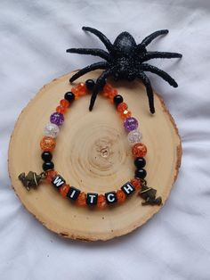 Colorful Elastic Beaded Bracelet with word Beads with small Witch charms...approx. 7in long Witch Charms, Witch Bracelet, Word Bracelets, Jewelry Halloween, Bracelets Beaded, Word Bracelet, Halloween Jewelry, Handmade Bracelets, Beaded Bracelet