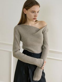 Editor's NoteOURCOMOS draws inspiration from the beautiful Lake Como in northern Italy, aiming to express deep and beautiful inner elements with a moody atmosphere.- Made of Merino wool and cashmere blended fabric- Vertically ribbed pattern- Comfortable and flexible fit- Unbalance boat neck design with one side off-shoulder- Contrasting color of trimming at the cuff- High-quality finish for durability- Classic and feminine moodMeasurements(in.)One Size- Shoulder: 14.17 in.- Chest: 13.39 in.- Hem: 12.60 in.- Sleeve: 5.12 in. (W) * 24.80 in. (L)- Cuff: 3.54 in.- Length: 21.65 in.*Model Info: Height: 5.74 ft. / Bust: 30 in. / Waist: 23 in. / Hips: 34 in.*The model is wearing ONE SIZE.Composition & Care- Material: Shell: 45% Nylon, 42% Polyester, 10% Merino Wool, 3% Cashmere- Dry clean rec Boat Neck Design, Summer Pullover, Mens Knit, Top Korean, Beautiful Sweater, Northern Italy, W Concept, Asymmetrical Tops, Beautiful Lakes