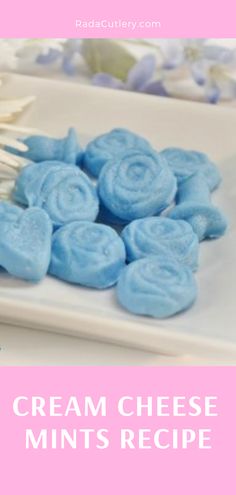 a white plate topped with blue candy lollipops