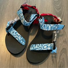 These Super Cute Bandana Sandals Are Trendy And Earth Friendly! The Base Is Partially Made Out Of Recycled Plastic Bottles, And The Bottom Was Printed With The Brand’s Cactus Logo. The Bandana Fabrics Used Are Light Blue, Red, And Grey. The Straps Have Velcro So That You Can Adjust Them To Fit Your Feet Perfectly. Blue Ankle Strap Casual Sandals, Casual Blue Ankle Strap Sandals, Casual Adjustable Blue Sport Sandals, Casual Blue Adjustable Sport Sandals, Casual Blue Sport Sandals With Ankle Strap, Casual Blue Ankle Strap Sport Sandals, Blue Sport Sandals With Ankle Strap For Summer, Blue Ankle Strap Sport Sandals For Summer, Adjustable Blue Sport Sandals For Summer