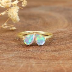 AAA Ethiopian opal ring for women, fire opal ring, minimalist ring, ring for her, Statement ring, October birthstone, fire opal jewelry, Double opal ring, 925 Sterling silver ring gift for her. *Other Similar Jewelry Available Here* https://www.etsy.com/shop/AreebaJewelry Details:- Gemstone - Ethiopian Opal Stone Color Available - Natural White  Stone Setting - Prong Fire - Rainbow Multi fire Birthstone - October birthstone Quality - AAA Grade Rize Size - 4 US TO 9 US Available Type - 100% Natural Opal Shipping service - Free worldwide shipping service About AreebaJewelry:- Areeba jewelry takes great pride in the design and craftsmanship of our fine jewelry pieces. We use only the finest materials and the highest manufacturing standards. We strive to make sure every jewelry piece we design Teardrop Opal Ring As A Gift, Opal Open Ring For Promise, Adjustable Opal Ring Jewelry, Minimalist Opal Rings With Birthstone, Minimalist Opal Ring With Birthstone, Minimalist Rings As Gift For Her, Minimalist Open Opal Ring For Anniversary, Opal Moonstone Ring For Anniversary, Minimalist Opal Birthstone Ring For Anniversary