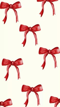 several red bows tied together on a white background