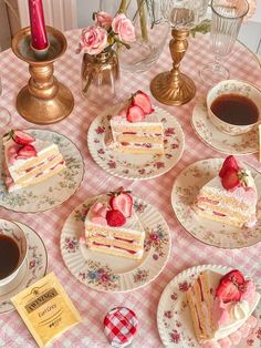 there are many pieces of cake on the table with cups and saucers next to them