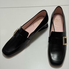 Roger Vivier Viv Rangers Leather Buckle Heeled Loafers, Black, Size 39.5. New In Box. Might Have Some Minor Scratches On The Smooth Leather. Not Very Noticeable. Please Refer To The Pictures Black Square Toe Leather Shoes For Office, Black Square-toe Calf Leather Loafers, Black Square Toe Calf Leather Loafers, Office Loafers With Branded Heel Counter And Flat Heel, Office Loafers With Branded Heel Counter, Black Patent Leather Loafers With Square Toe, Chic Loafers With Low Heel In Calf Leather, Luxury Low Heel Flats For Work, Elegant Slip-on Court Shoes For Office