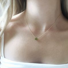 This genuine peridot gemstone sits on a dainty gold filled, sterling silver, rose gold filled or 14k gold chain. Subtle and simple, this beautiful semi-precious stone necklace is perfect by itself or for layering with other necklaces. Peridot is the birthstone for August. Jewelry is handmade by us in NYC focusing on quality using only the highest quality materials and handpicked genuine gemstones. The length on the model is 16 inches. ▹ PACKAGING All jewelry is beautifully wrapped in tissue and August Jewelry, August Birthstone Necklace, Peridot Birthstone, Peridot Jewelry, Peridot Necklace, Jewelry Minimalist, August Birthstone, Necklace Minimalist, Peridot Gemstone