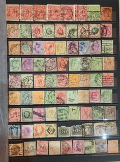 a collection of stamps on display in a frame