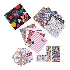 various mickey mouse stickers and papers on a white background