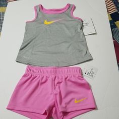 Elastic Waistband Shorts And Snap Closure Pullon Style Tank In Psychic Pink Pink Stretch Top For Playtime, Pink Workout Set For Spring, Pink Workout Sets For Spring, Pink Spring Workout Sets, Playful Nike Sports Sets, Nike Sporty Sets For Playtime, Pink Sporty Gym Sets, Playful Nike Playwear Sets, Nike Pink Playwear Sets