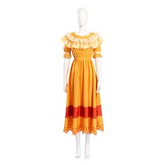 a mannequin wearing a yellow dress with red and orange stripes on the bottom