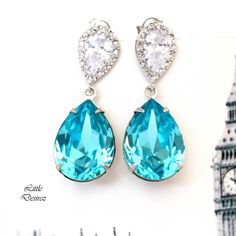 "If you're looking for that irresistible 'Bridal Blue color' then look no beyond, these unique and one-of-a-kind Swarovski teal crystals are the perfect choice! I made these gorgeous Earrings with: - 18x13mm genuine Light Turquoise Swarovski teardrop pear shaped fancy stones, set in sterling silver plated settings - Hypoallergenic, Rhodium plated and tarnish resistant .925 Sterling Silver pear shaped ear posts with AAA cubic zirconia stones - these are approx 1 1/4\" from top of the ear posts to Blue Cubic Zirconia Teardrop Earrings For Wedding, Elegant Turquoise Drop Crystal Earrings, Blue Cubic Zirconia Crystal Earrings For Wedding, Elegant Turquoise Teardrop Earrings For Party, Elegant Turquoise Bridal Earrings, Blue Teardrop Crystal Earrings For Wedding, Elegant Turquoise Bridal Earrings For Wedding, Turquoise Wedding Jewelry For Pierced Ears, Elegant Turquoise Teardrop Earrings