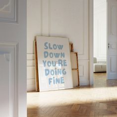 there is a sign that says slow down you're doing fine on the floor