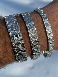 Men's handmade custom silver nugget bracelets
 
Solid 925 sterling silver 
Handmade in Italy
 
Stamped "925"

 
Available in 8mm 12mm or 16mm

 
Very heavy bracelets
Listed are weights for 8.5" (7" is slightly less)
8mm - 16.7 grams
12mm - 19.8 grams
16mm - 51.1 grams
 
Very comfortable to wear.
Very classy understated piece! Mens Pinky Ring, Nugget Bracelet, 14k Yellow Gold Necklace, Tungsten Wedding Rings, Gold Nugget, Mens Leather Bracelet, Mens Accessories Jewelry, Gold Bracelet Chain, Sterling Silver Mens