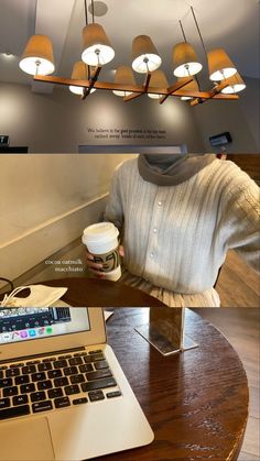 a laptop computer sitting on top of a wooden table next to a cup of coffee