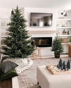 the living room is decorated with christmas trees