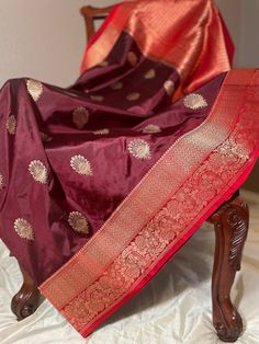 A beautiful dark brown and red border banarasi pure katan silk saree.With zari motif all over the body and floral zari border. Completed with a rich pallu and plain red running blouse piece with zari border on one side. Blouse cloth size: 1.10 m by 0.87 m No falls, pico or tassels done Maintenance: Dry wash advisable Returns and refund only accepted on defective products. Product should be shipped back in 3 days after delivery . Please go through our return policies below. Our Policy on Returns, Banarasi Katan Silk Saree, Plain Red, Initial Sign, Indian Bride Outfits, Katan Silk Saree, Bride Outfits, Trendy Blouse, Red Border, Trendy Blouses