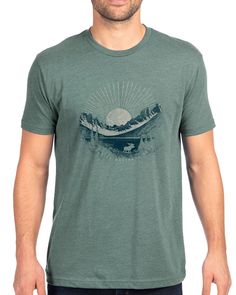 Our Glacier National Park tee showcases one of our favorite views in the park printed with an earthy color scheme on our dusty pine colored tee. The artwork is then lightly textured with topographic maps from the area, giving the print that warm and well-loved look and feel. This is an easy care, comfortable t shirt that you'll feel comfortable wearing all day. It can be a great souvenir remembrance of your vacation to Glacier. Or give it as a birthday gift or Christmas gift to friends and famil Green Graphic Tee For Outdoor, Green Graphic Tee For Outdoor Activities, Green T-shirt For Outdoor Activities, Outdoor Green T-shirt With Graphic Print, Green Graphic Print Outdoor T-shirt, Green Graphic Print T-shirt For Outdoor, Green Printed T-shirt For Outdoor Activities, Green Graphic Print Outdoor Shirt, Green Graphic Print Shirt For Outdoor