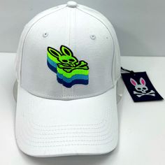 Psycho Bunny Baseball Cap,100% Cotton, Adjustable Strap, Embroidered Logo,Unisex . Brand New Never Used . Original Tags Attached . Authentic And Real Product . The Color White . The Bunny Logo Is Embroided In Green, Blue & Black . Very High-End, Prestigious, And Comfortable ******** Unisex******** Non Smoking House Ambassador Ii, For Over Two Years Same Day Shipping 5 Star Customer Ratings All Offers Are Welcomed White Hats For Spring Streetwear, White Cotton Baseball Cap With Embroidered Logo, White Embroidered Baseball Cap With Curved Bill, Spring Streetwear Hats With Embroidered Logo, White Cotton Hat With Embroidered Logo, White Embroidered Cotton Baseball Cap, White Embroidered Hat With Curved Bill, Embroidered White Baseball Cap For Streetwear, White Embroidered Baseball Cap For Streetwear