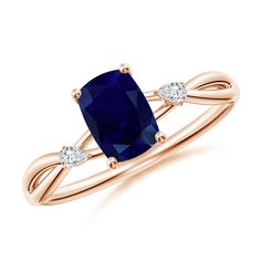 a blue sapphire and diamond ring with two diamonds on the band, set in 18k rose gold