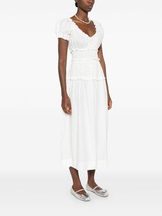 Find DÔEN Leanne Midi Dress on Editorialist. white organic cotton poplin texture frilled neckline short puff sleeves ruffle cuffs smocked waist A-line skirt straight hem mid-length We've partnered with Good On You — an independent agency that rates how brands perform in relation to their impact on the planet, people and animals, with a multi-criteria rating simplified to a five points scale. In order to be awarded our conscious label, larger brands need to score a minimum of four out of five ('Good'), while smaller brands must score at least three out of five ('It's A Start'). This item comes from a brand rated three out of five ('It's A Start') by Good on You at the time it was added on FARFETCH. Please note, this is a brand-level rating and does not guarantee that this product is made wi Feminine Cotton Midi Dress With Fitted Bodice, Cotton Midi Dress With Fitted Bodice, Feminine Style, Elegant Cotton Midi Dress With Gathered Neckline, Feminine Cotton Midi Dress With Smocked Bodice, Fitted Cotton Midi Dress With Smocked Bodice, Elegant Cotton Dress With Gathered Neckline, Feminine Cotton Midi Dress With Ruched Details, Yellow Midi Dress, Neck Bow