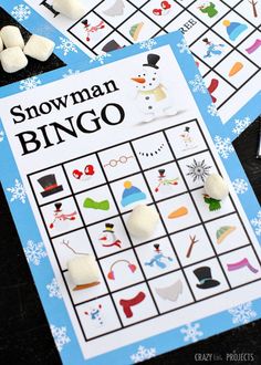 snowman bingo game with marshmallows on the top and other items around it