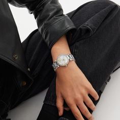 Timeless and elegant the Cary watch is a sophisticated style perfect for day or night. The sleek stainless steel bracelet design features a shimmering crystal bezel and a luminous mother-of-pearl dial detailed with gold tone accents and a floating scatter of our signature charms. | Coach Cary Watch, 34 Mm - Women's - Stainless Steel