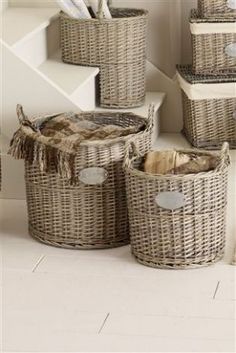 wicker baskets are stacked on the floor