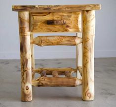 a small wooden table made out of logs