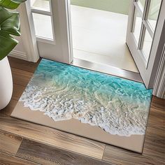 a door mat with an image of the ocean on it and waves coming in from the water