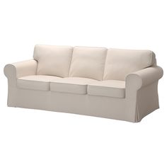 a white couch with two pillows on it