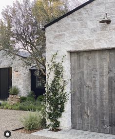 the instagram page shows an image of a house and its front door, which is surrounded by greenery