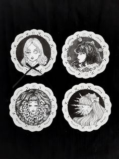 four plates with drawings of women on them, one is holding a knife and the other has long hair