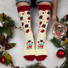 PREMIUM QUALITY: This set of four knit socks are made from a blend of 70% Cotton, 28% Polyester, and 2% Spandex. These socks fit 9-13 US Women | 39-43 UK Women and 8-12 US Men | 41-45 UK Men. The first pair is yellow with burgundy red toe, heel & ankle, including green and red presents; the top of the socks has a red wine glass character and an "It's The Most Wonderful Wine Of The Year" sentiment. IN-HOUSE DESIGN: The second pair is green, including a white snowflake wrap-around design; the top Cool Christmas Socks, Playful Red Winter Socks, Novelty Cotton Winter Socks, Christmas. Womens Socks, Holiday Socks, Christmas Wine, White Snowflake, Green And Red, Knit Socks