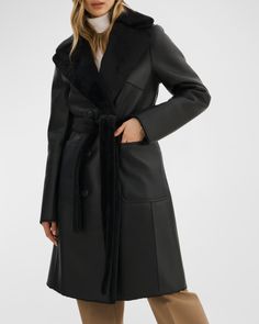 LaMarque "Abigail" peacoat featured in fully reversible faux shearling (polyester/polyurethane/polyester)    Approx. 40.5”L from shoulder to hem    Notched lapels; doublebreasted front    Long sleeves    Front patch pockets    Removable tie belt    Midlength    Dry clean    Imported Leather Industry, Reversible Coat, Leather Pieces, Outerwear Coats, Puffer Coat, Tie Belt, Outerwear Women, Black Coat, Wool Coat