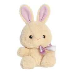 a small stuffed rabbit with a purple ribbon around its neck, sitting on a white background