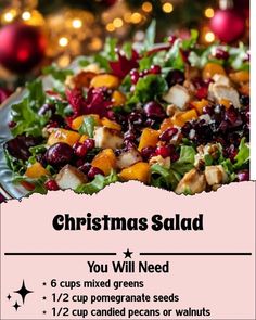 a christmas salad with oranges, cranberries and nuts on it is shown