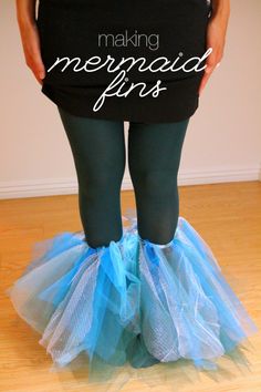 a woman in black shirt and blue tulle skirt with words making mermaid girls on it