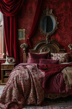 a bedroom with red walls, curtains and a bed in the middle is covered by a maroon comforter