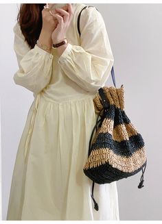 In Stock Fast Shipping From Los Angeles Saddle up for summer with the Elena Handbags Fashion Stripe Straw Drawstring Bag! This stylishly striped straw bag is the perfect accessory for the sizzle season. With its drawstring closure and light-as-air feel, it's the ideal accessory to cinch up your style. Saddle up and look sharp! Size: 38cm wide x 31cm tall (15in x 12in) Designer Style ID: 8482 Large Fashion Straw Woven Tote Bag, Vintage Vibes, Summer Bag, Everyday Shoulder Bag, Beach Bag Casual Straw Bucket Bag For Spring, Striped Bags For Spring Beach Outings, Spring Striped Beach Bags, Spring Beach Striped Bags, Casual Striped Woven Straw Bag, Black Beach Bag For Spring Travel, Summer Striped Woven Straw Bag, Casual Striped Woven Bag, Casual Striped Shoulder Bag For Summer