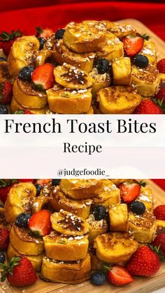 french toast bites are stacked on top of each other with strawberries and blueberries