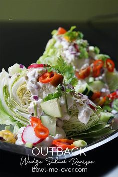 lettuce, carrots and other vegetables are on a plate with some dressing