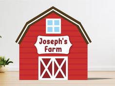 a red barn with a sign that says joseph's farm